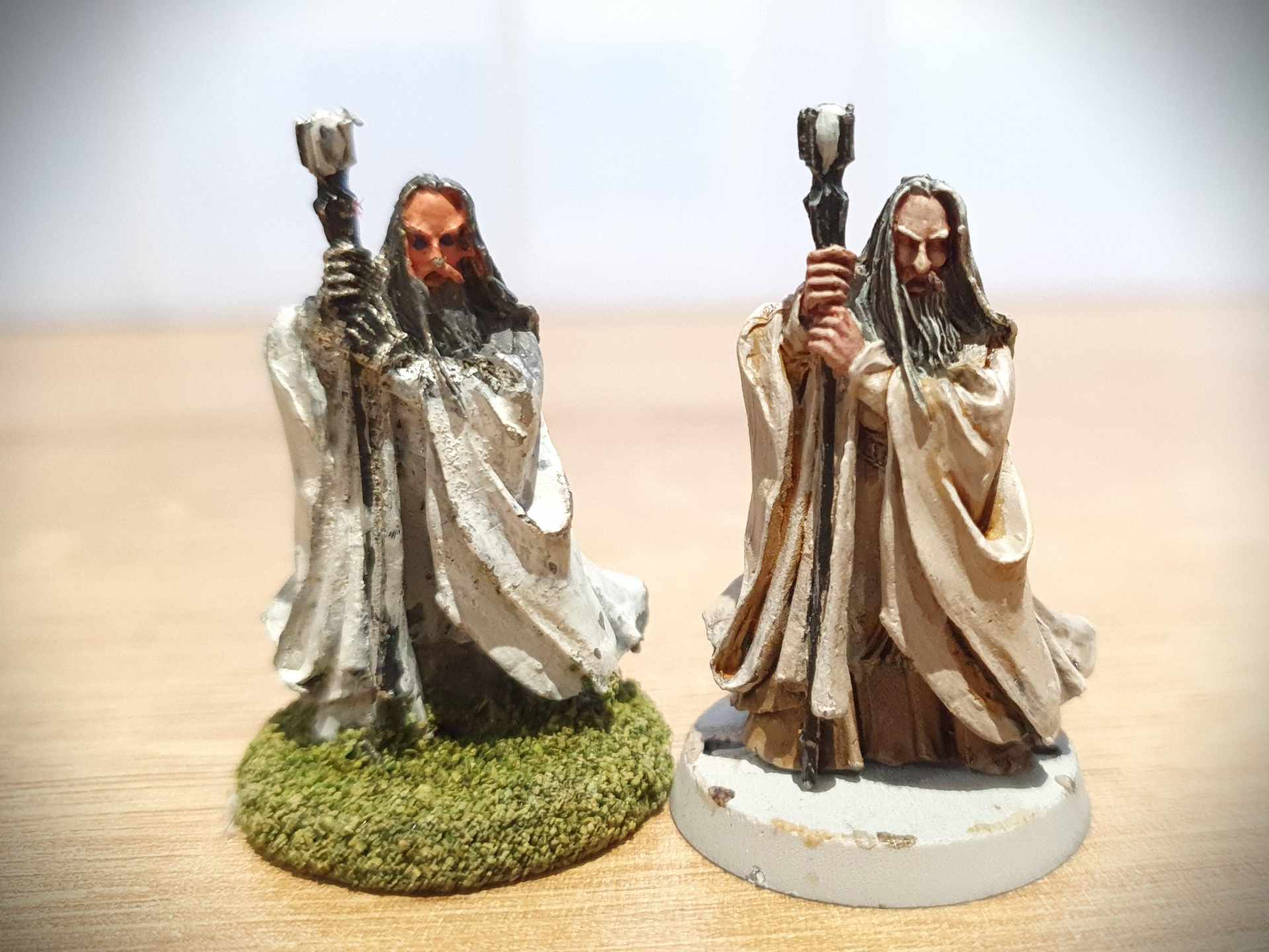 A side-by-side comparison of the Saruman I pained when I was 13, and the first model I painted on return to the hobby 20 years later.